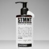 STMNT Conditioner fles met pomp en witte crème voor haarverzorging.